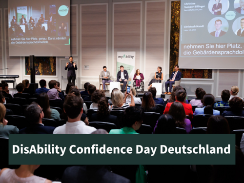 DisAbility Confidence Day Deutschland Podium auf der Bühne mit Publikum im Vordergrund