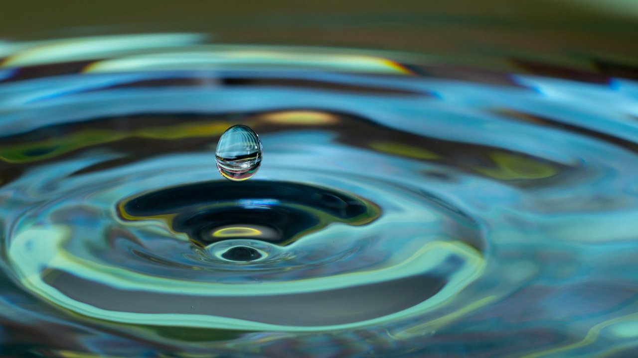 A droplet in a lake that creates circular waves