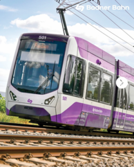 Badnerbahn mit lilafarbener Beklebung.